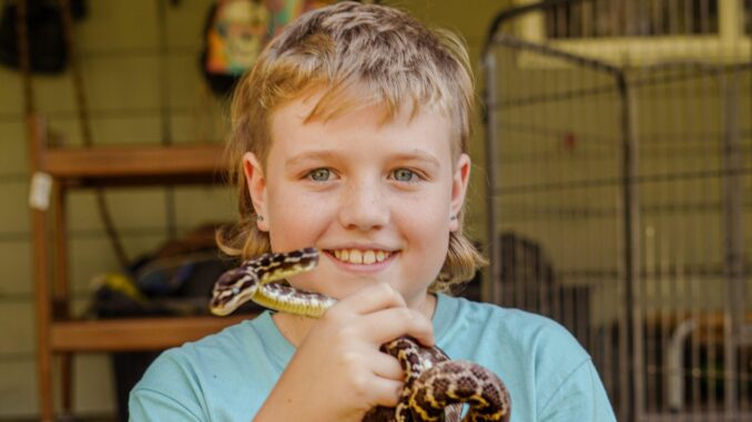 Max McMahon and Daisy the Rough Scaled Python