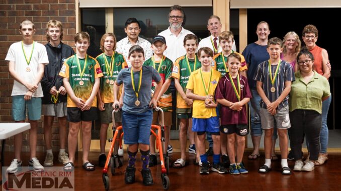 Sportsperson of the Year Kai Crothers (front, centre) with Sportsperson monthly award winners, 2020 Sportsperson winner Morgan Lee (right), committee members and supporters