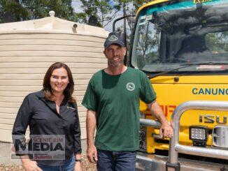 Urban Utilities' spokesperson Michelle Cull and Canungra Rural Fire Service volunteer officer Chris Browning